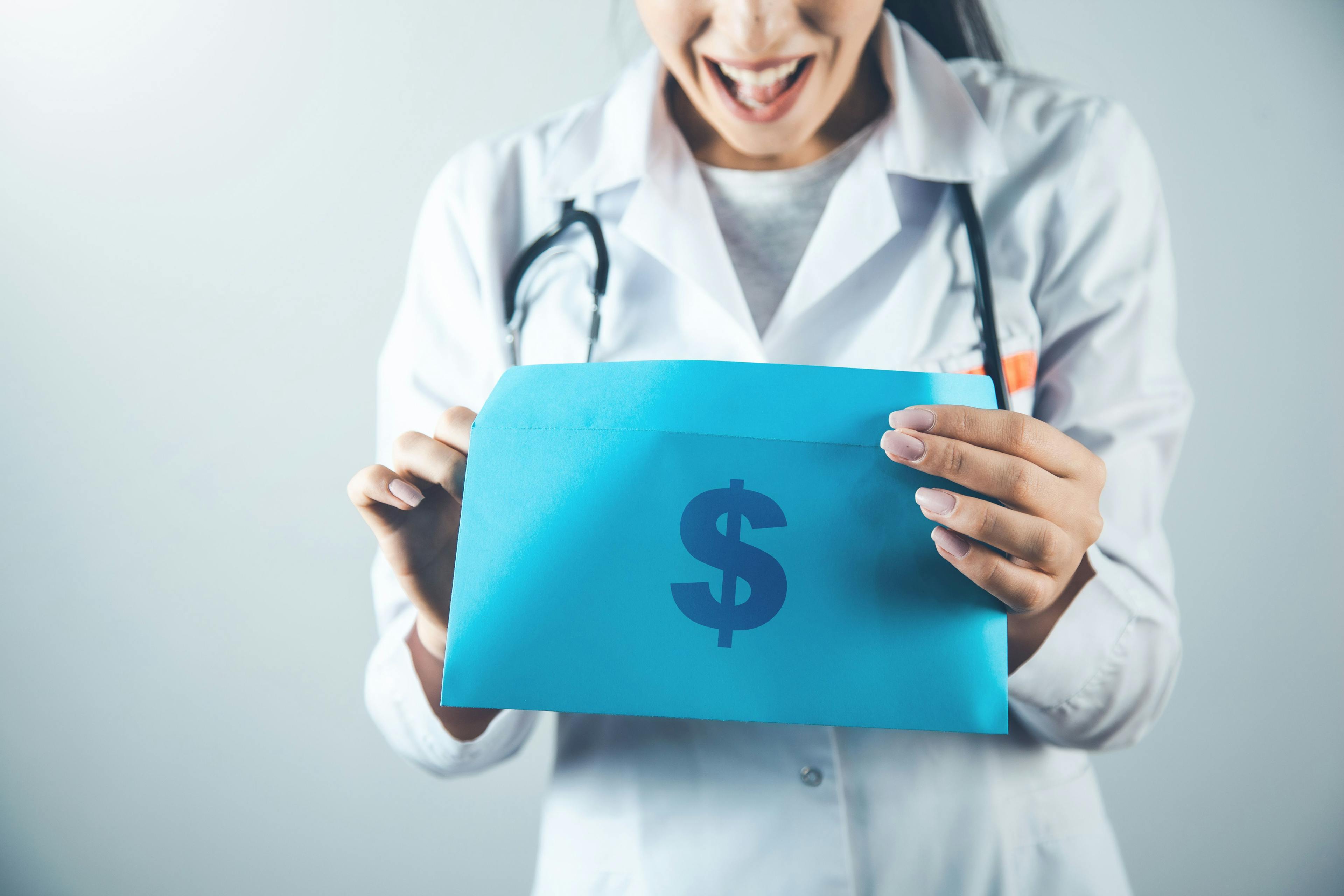 doctor happy with folder of money