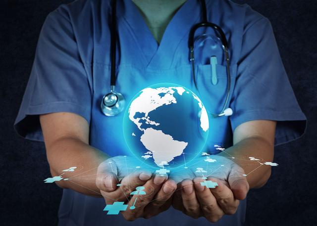 physician with world in hands concept: © everythingpossible - stock.adobe.com